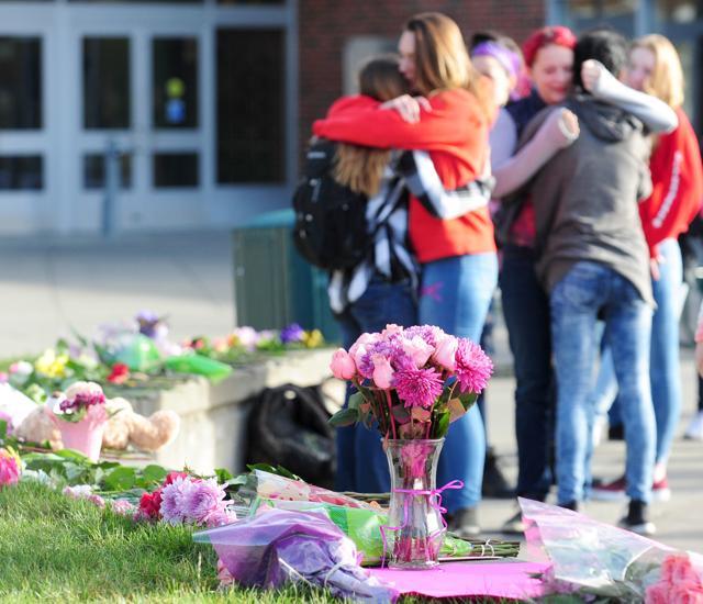 Mount Vernon High School students gather in the school's courtyard and embrace near an impromptu memorial for Sarai Lara, a sophomore who was killed in the shooting at Cascade Mall. (AP Photo) Mount Vernon High School students gather in the school's courtyard and embrace near an impromptu memorial for Sarai Lara, a sophomore who was killed in the shooting at Cascade Mall. (AP Photo)