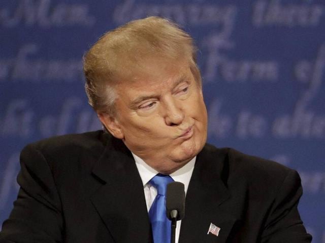 Republican presidential nominee Donald Trump listens to Democratic presidential nominee Hillary Clinton during the presidential debate at Hofstra University in Hempstead.(AP Photo) Republican presidential nominee Donald Trump listens to Democratic presidential nominee Hillary Clinton during the presidential debate at Hofstra University in Hempstead.(AP Photo)