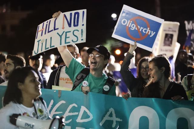 Protesters gather before the presidential debate at Hofstra University. (AP) Protesters gather before the presidential debate at Hofstra University. (AP)