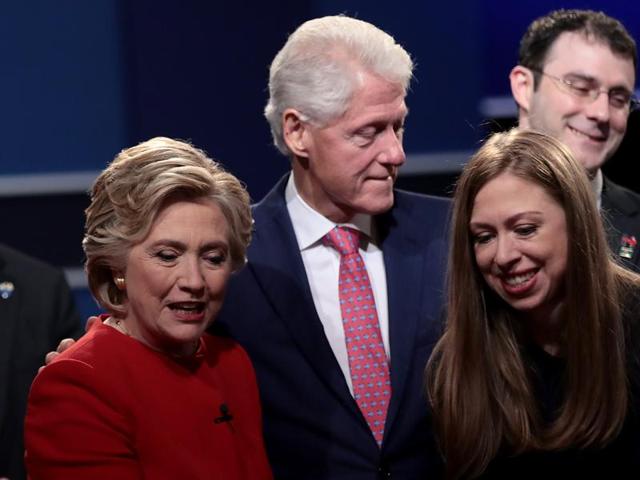 (From left) Democratic presidential nominee Hillary Clinton looks on with husband and former US president Bill Clinton and daughter, Chelsea Clinton after the presidential debate with Republican presidential nominee Donald Trump at Hofstra University in Hempstead, New York. (AFP Photo)