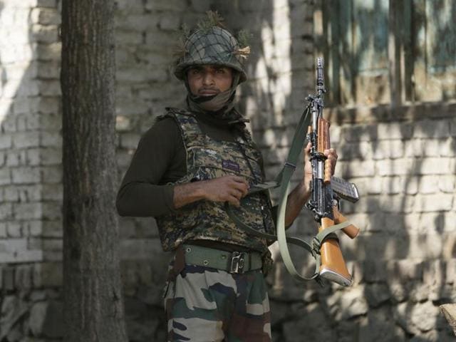 An Indian Army soldier patrols at Nowgam sector, near the de facto border.(AP Photo)