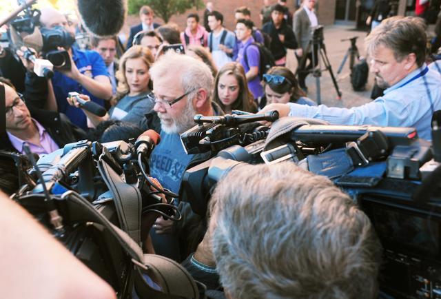 Arcan Cetin's stepfather David Marshall is swarmed by the media outside the Skagit County District Court . (AP Photo) Arcan Cetin's stepfather David Marshall is swarmed by the media outside the Skagit County District Court . (AP Photo)