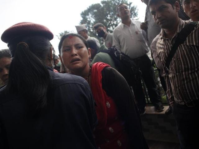 Family members of injured passengers, rescued after an overcrowded bus slipped off a mountain road gather at the Teaching hospital in Kathmandu, Nepal.(AP) Family members of injured passengers, rescued after an overcrowded bus slipped off a mountain road gather at the Teaching hospital in Kathmandu, Nepal.(AP)