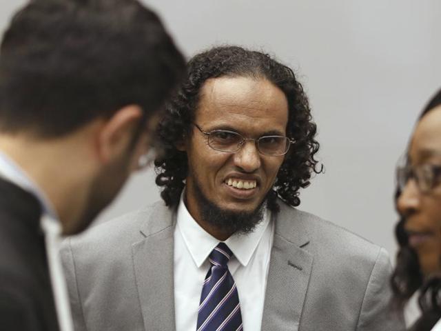 Ahmad Al Faqi Al Mahdi, a Malian jihadi who pleaded guilty to destruction of historic mausoleums in Timbuktu, listens to his defence team as he enters the court room to hear the verdict of the International Criminal Court in The Hague, Netherlands, Tuesday.(AP Photo)