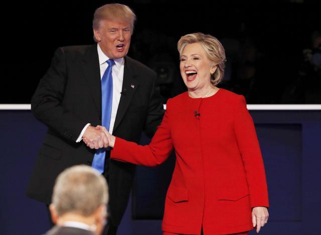 Republican US presidential nominee Donald Trump shakes hands with Democratic US presidential nominee Hillary Clinton at the conclusion of their first presidential debate at Hofstra University in Hempstead, New York. (REUTERS) Republican US presidential nominee Donald Trump shakes hands with Democratic US presidential nominee Hillary Clinton at the conclusion of their first presidential debate at Hofstra University in Hempstead, New York. (REUTERS)