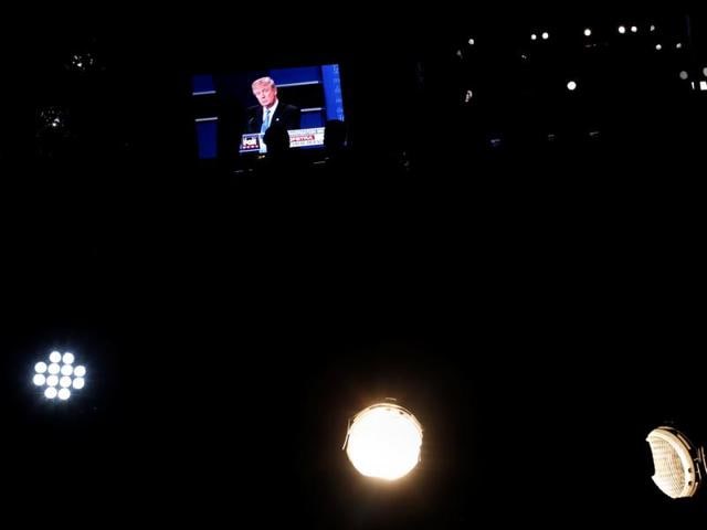 US Republican nominee Donald Trump is seen telecasted on a video screen outside Hofstra University. (Reuters Photo)