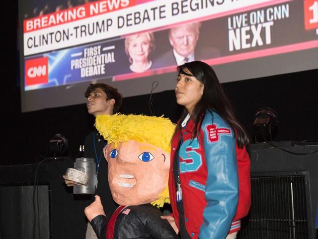 Area students stand with a Donald Trump pinata during a presidential debate watch party in Dallas, Texas (AFP Photo)