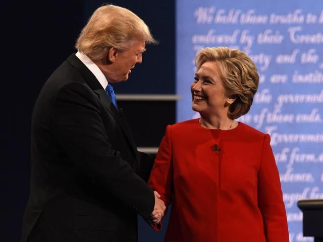 Republican US presidential nominee Donald Trump speaks as Democratic Upresidential nominee Hillary Clinton listens during their first presidential debate at Hofstra University in Hempstead, New York.(Reuters Photo) Republican US presidential nominee Donald Trump speaks as Democratic Upresidential nominee Hillary Clinton listens during their first presidential debate at Hofstra University in Hempstead, New York.(Reuters Photo)