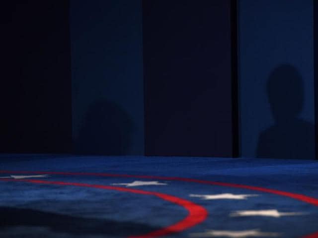The shadows of Republican nominee Donald Trump (left) and Democratic nominee Hillary Clinton are seen during the first presidential debate at Hofstra University in Hempstead, New York. (AFP Photo)