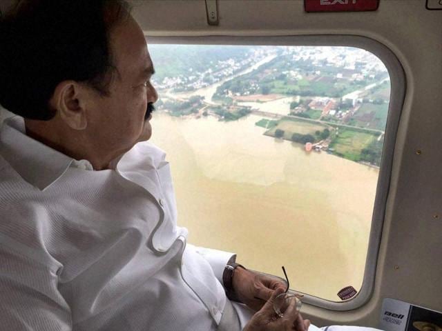Union minister M Venkaiah Naidu conducts an aerial survey of flood-affected areas in Guntur district of Andhra Pradesh on Tuesday. (PTI) Union minister M Venkaiah Naidu conducts an aerial survey of flood-affected areas in Guntur district of Andhra Pradesh on Tuesday. (PTI)