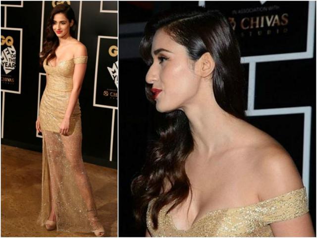 Disha Patani shimmered in a golden dress with a Bardot-neckline, perfectly paired with her ruby lips. (Agencies)