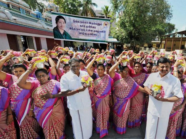 AIADMK MLAs Amman Arjunan and PRG Arunkumar offer prayers with women party members for the speedy recovery Tamil Nadu chief minister J Jayalalithaa, in Coimbatore.(PTI) AIADMK MLAs Amman Arjunan and PRG Arunkumar offer prayers with women party members for the speedy recovery Tamil Nadu chief minister J Jayalalithaa, in Coimbatore.(PTI)