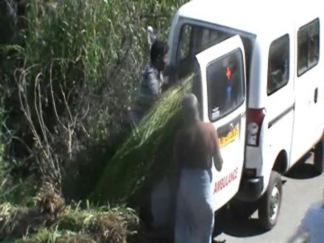 People loading fodder in the ambulance in Sagar.(HT photo)