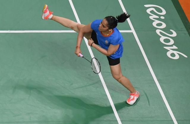 An overview shows India's Saina Nehwal return to Brazil's Lohaynny Vicente during their women's singles qualifying badminton match at the Riocentro stadium in Rio de Janeiro on August 11, 2016, at the Rio 2016 Olympic Games. (AFP) An overview shows India's Saina Nehwal return to Brazil's Lohaynny Vicente during their women's singles qualifying badminton match at the Riocentro stadium in Rio de Janeiro on August 11, 2016, at the Rio 2016 Olympic Games. (AFP)