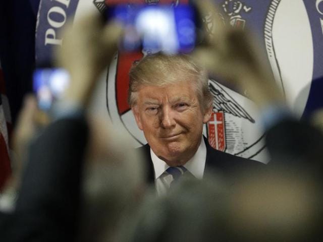 US Republican presidential nominee Donald Trump gestures at supporters during a campaign rally at the Orlando Melbourne International Airport in Melbourne, Florida, on Wednesday.(AFP) US Republican presidential nominee Donald Trump gestures at supporters during a campaign rally at the Orlando Melbourne International Airport in Melbourne, Florida, on Wednesday.(AFP)