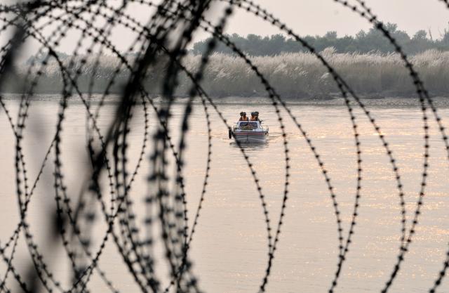 An Indian Army soldier keeps vigil at his post near a military base at Braripora. (AP)