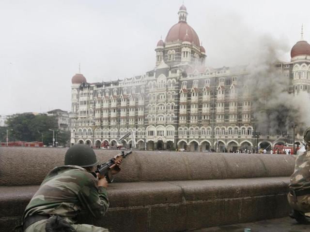 Indian Army soldiers take up position during a gun battle at the Taj Mahal hotel in Mumbai in this November 29, 2008 photo.(Reuters Photo)