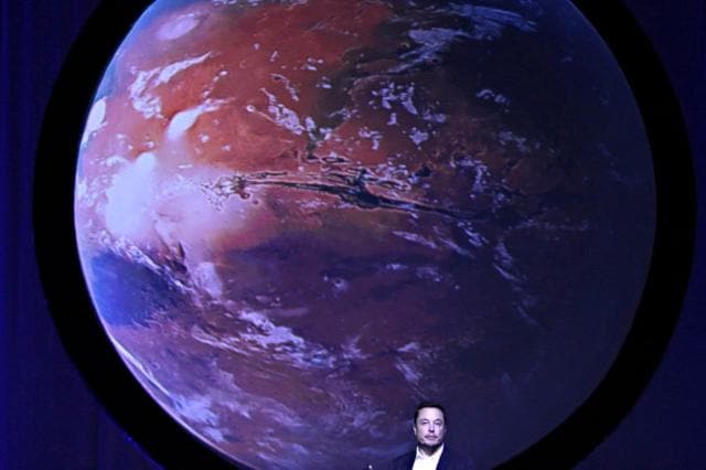 SpaceX CEO Elon Musk unveils his plans to colonize Mars during the International Astronautical Congress in Guadalajara, Mexico. (Reuters) SpaceX CEO Elon Musk unveils his plans to colonize Mars during the International Astronautical Congress in Guadalajara, Mexico. (Reuters)