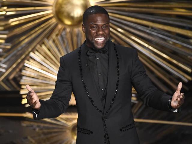 Kevin Hart speaks at the Oscars at the Dolby Theatre in Los Angeles. Hart is literally laughing all the way to the bank. The funnyman tops the Forbes magazine list of the highest paid comedians with earnings of $87.5 million.(AP)