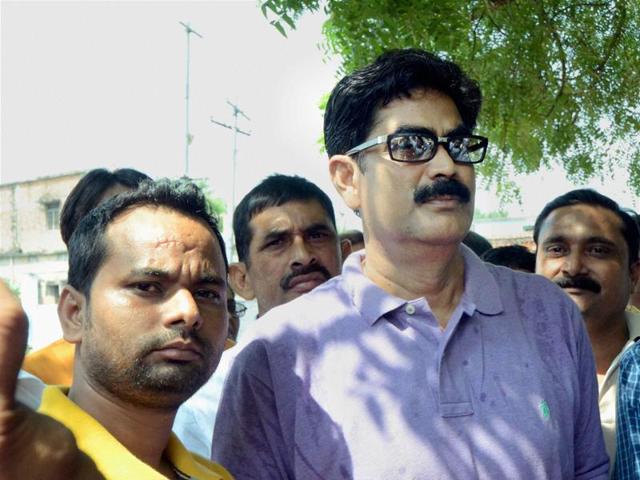 Former RJD MP Mohammad Shahabuddin with his supporters in Siwan on Monday.(PTI Photo)