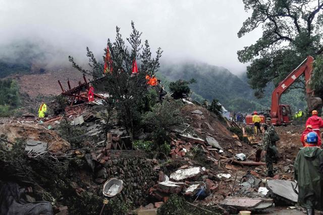 Chinese rescuers search for survivors at a landslide area in the village of Sucun in Suichang county, in China's Zhejiang province on September 29. (AFP) Chinese rescuers search for survivors at a landslide area in the village of Sucun in Suichang county, in China's Zhejiang province on September 29. (AFP)