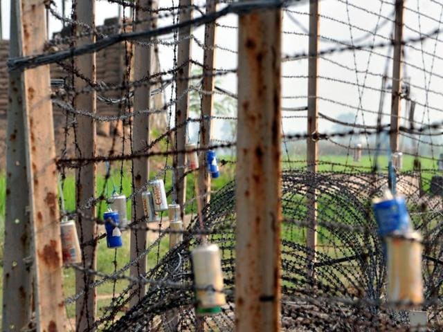 Empty canisters of soft drinks tied up with barbed fence at a forward location on Indo-Pak border in Jammu on September 25, 2016.(Nitin Kanotra / HT Photo) Empty canisters of soft drinks tied up with barbed fence at a forward location on Indo-Pak border in Jammu on September 25, 2016.(Nitin Kanotra / HT Photo)