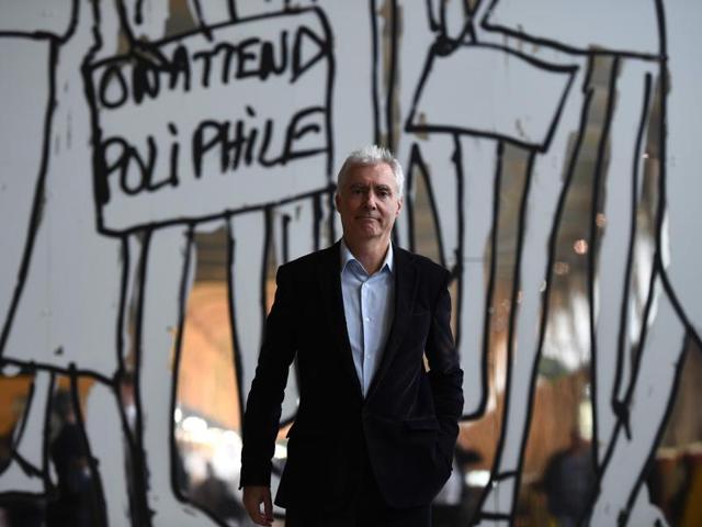 French artist Alain Sechas poses in front of an artwork. (AFP) 