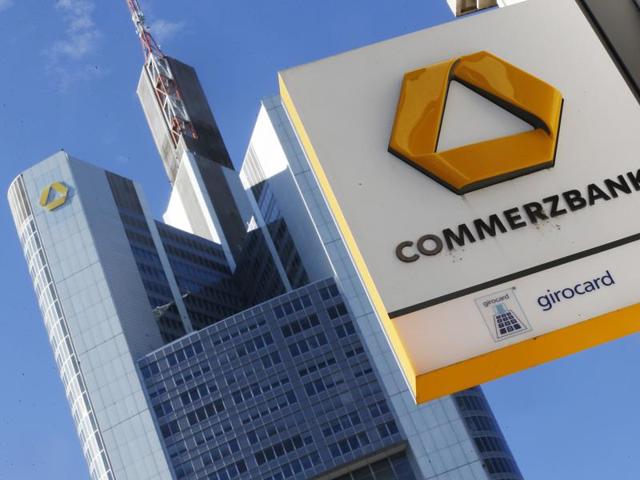 Bankers pass the Commerzbank headquarters in Frankfurt, Germany. Commerzbank issued an ad-hoc statement Thursday that they aim at reducing staffing by 9600 jobs. (AP) Bankers pass the Commerzbank headquarters in Frankfurt, Germany. Commerzbank issued an ad-hoc statement Thursday that they aim at reducing staffing by 9600 jobs. (AP)