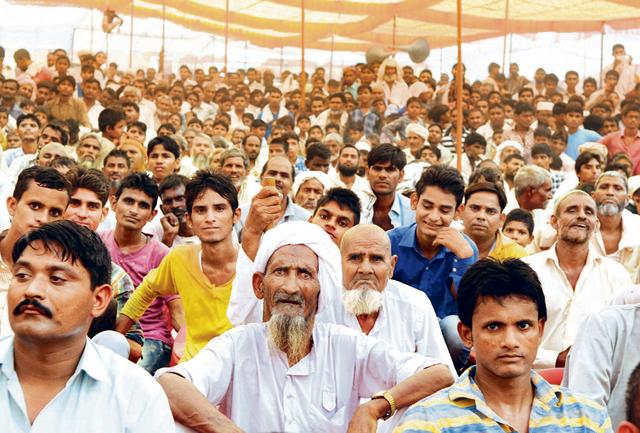 The crowd braved the sultry weather expecting some doles but they were left unhappy by the hour-long event that looked more like a political rally.(Parveen Kumar/HT Photo) The crowd braved the sultry weather expecting some doles but they were left unhappy by the hour-long event that looked more like a political rally.(Parveen Kumar/HT Photo)