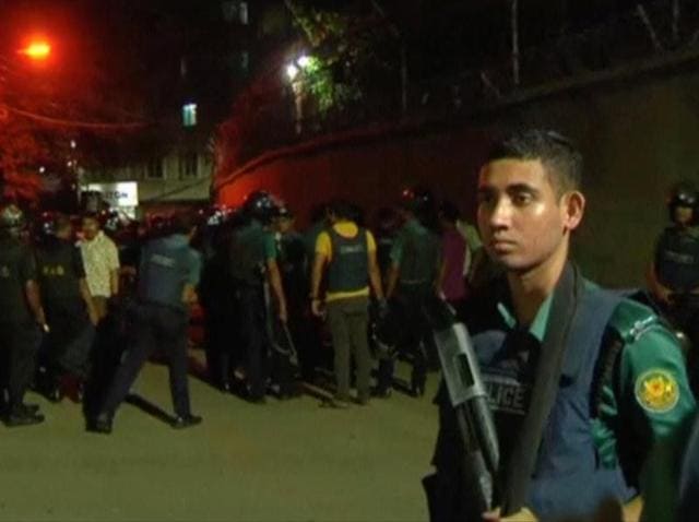 Members of the rapid action police battalion stand outside a house of Dhaka attack suspects in Dhaka.(Reuters file photo)