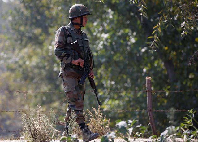An Indian army soldier patrols along a highway on the outskirts of Srinagar. (REUTERS) An Indian army soldier patrols along a highway on the outskirts of Srinagar. (REUTERS)