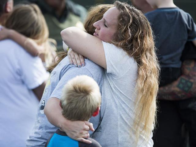 People hug after recovering their children after a shooting at Townville Elementary on Wednesday. (AP) People hug after recovering their children after a shooting at Townville Elementary on Wednesday. (AP)