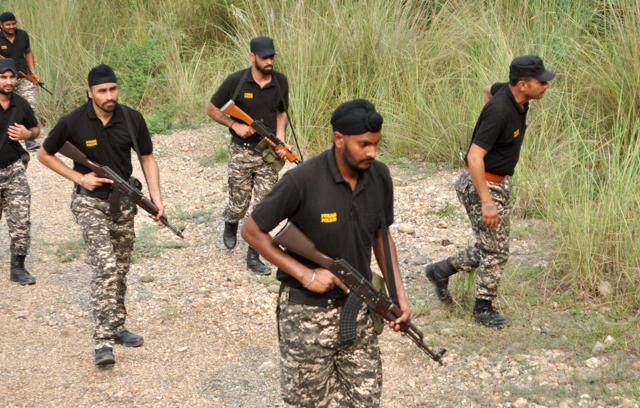 Security personnel carrying out a combing operation in the hilly areas on the Punjab-Himachal border. (PTI Photo) Security personnel carrying out a combing operation in the hilly areas on the Punjab-Himachal border. (PTI Photo)