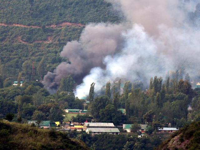 Smoke rises from the army base which was attacked by by militants in Uri, west of Srinagar on September 18, 2016.(HT file photo)