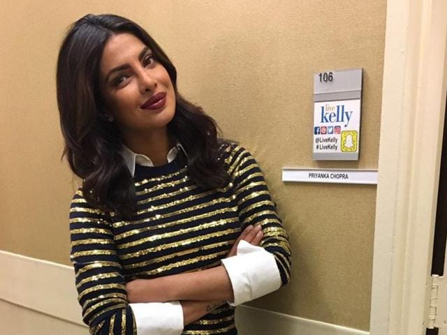 Soaked in excitement about the positive reviews of her ongoing second season of American thriller Quantico, Priyanka looked sizzling in a striped golden shirt and a blue skirt.(Twitter)