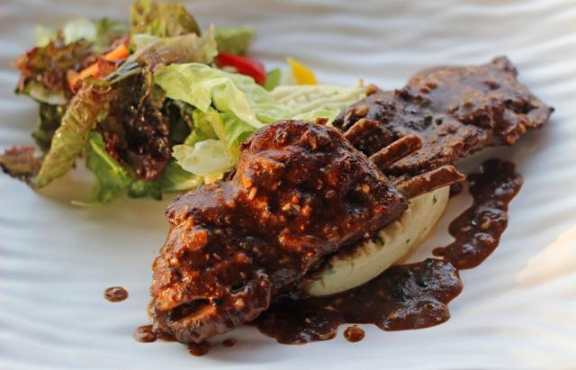 The Jamaican country ribs were two large, unwieldy racks of pork ribs that were tough and chewy, and hadn’t quite absorbed the flavours of the spice. (Satyabrata Tripathy/ HT Photo)