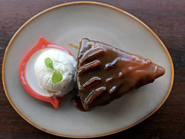 The bland, soft pudding was a perfect foil for the sweet, gooey toffee sauce that had been poured over it, in the case of the sticky toffee pudding. (Satyabrata Tripathy/ HT Photo)