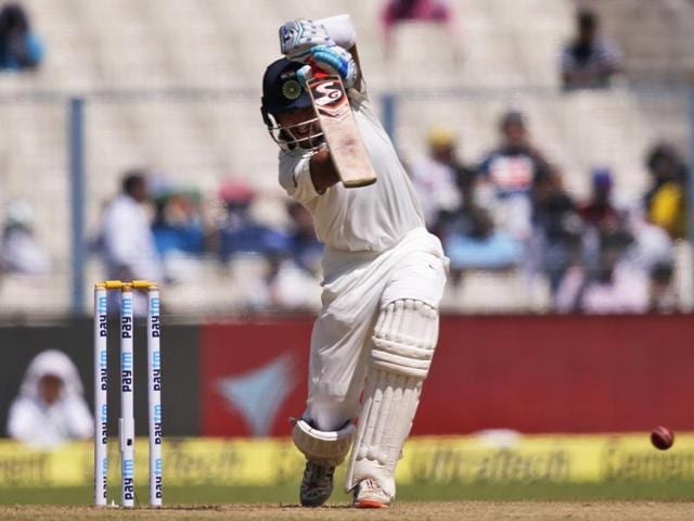 Cheteshwar Pujara drives a ball for a boundary on the first day of the second Test match against New Zealand, in Kolkata on Friday.(AP) Cheteshwar Pujara drives a ball for a boundary on the first day of the second Test match against New Zealand, in Kolkata on Friday.(AP)