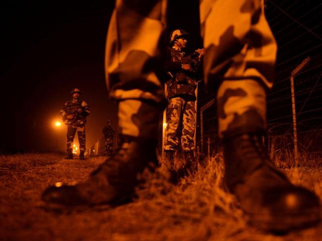 In this file photograph taken on January 12, 2013, Indian Border Security Force (BSF) soldiers patrol along a border fence at an outpost along the Line of Control (LOC) between India-Pakistan at Suchit-Garh, some 36 kms southwest of Jammu.(AFP)