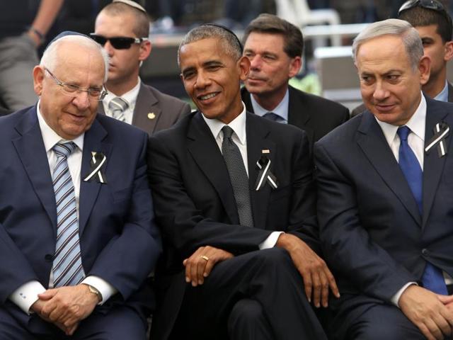 US President Barack Obama (centre) Israeli Prime Minister Benjamin Netanyahu (right) and Israeli President Reuven Rivlin chat during the funeral of former Israeli president and prime minister Shimon Perse at the Mount Herzl national cemetery in Jerusalem.(AFP Photo) US President Barack Obama (centre) Israeli Prime Minister Benjamin Netanyahu (right) and Israeli President Reuven Rivlin chat during the funeral of former Israeli president and prime minister Shimon Perse at the Mount Herzl national cemetery in Jerusalem.(AFP Photo)