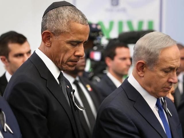 US President Barack Obama and Israeli Prime Minister Benjamin Netanyahu during the funeral of former Israeli president and prime minister Shimon Perse at the Mount Herzl national cemetery in Jerusalem. (AP Photo) US President Barack Obama and Israeli Prime Minister Benjamin Netanyahu during the funeral of former Israeli president and prime minister Shimon Perse at the Mount Herzl national cemetery in Jerusalem. (AP Photo)