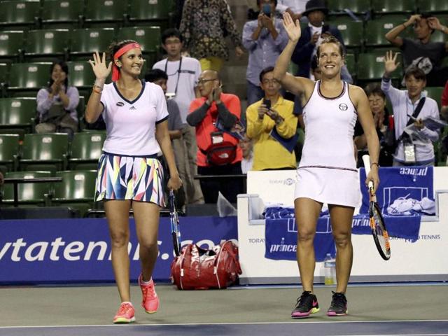 Sania Mirza, left, and her partner Barbora Strycova, of the Czech Republic, acknowledge the crowd. (AP Photo)