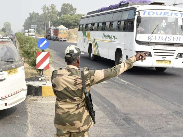 BSF men sending back the public headed to watch the evening retreat ceremony that was cancelled, at the Attari-Wagah border on Thursday. (Gurpreet Singh/HT Photo) 