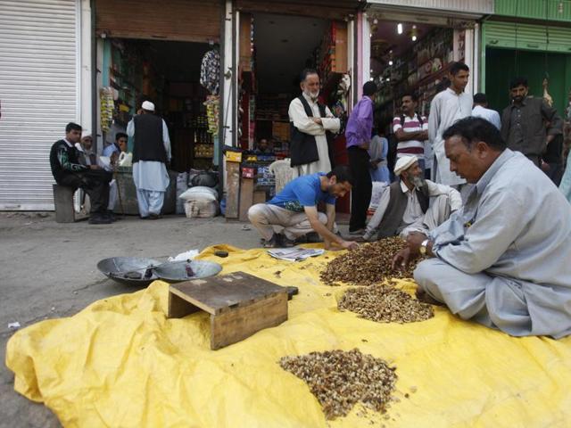 A shopkeeper sells walnut kernels at the market in Uri on Friday. The town made headlines earlier this month after four militants stormed an army camp and killed nineteen soldiers.(Waseem Andrabi / HT Photo) A shopkeeper sells walnut kernels at the market in Uri on Friday. The town made headlines earlier this month after four militants stormed an army camp and killed nineteen soldiers.(Waseem Andrabi / HT Photo)