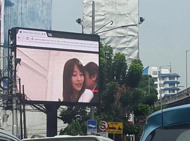 The pornographic video was broadcast on a public billboard in broad daylight in Jakarta and was captured on motorists’ phones and sent viral on social media.(Twitter/ @Prunamasari)