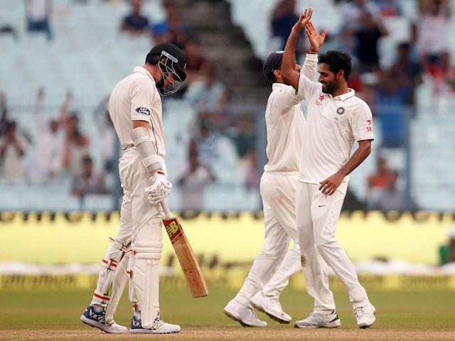 Bhuvneshwar Kumar (R) celebrates after taking the wicket of Mitchell Santner. (REUTERS) Bhuvneshwar Kumar (R) celebrates after taking the wicket of Mitchell Santner. (REUTERS)