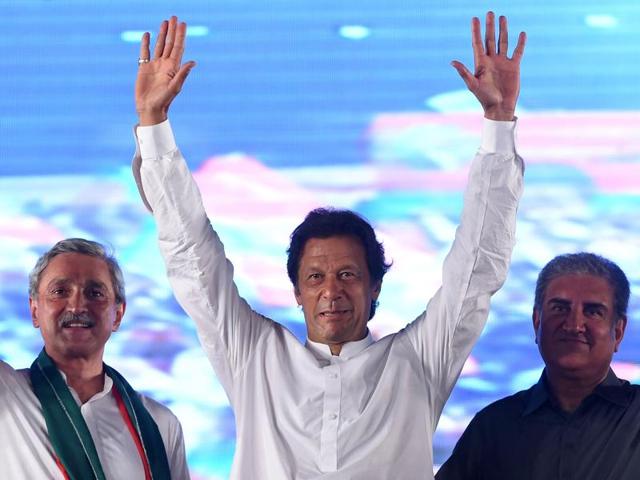 Pakistani cricketer-turned-opposition leader Imran Khan (C) waves to supporters during a public meeting in Raiwind on Friday night.(AFP) Pakistani cricketer-turned-opposition leader Imran Khan (C) waves to supporters during a public meeting in Raiwind on Friday night.(AFP)