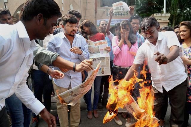 NCP activists protest in Thane against Shiv Sena chief Uddhav Thackeray and the party mouthpiece Saamana over the cartoon on Wednesday. (PTI)