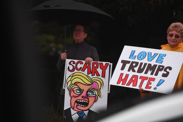 Protesters display placards outside the Suburban Collection Showplace in Novi, Michigan on Friday, during a campaign rally by US Republican presidential nominee Donald Trump. (AFP Photo) Protesters display placards outside the Suburban Collection Showplace in Novi, Michigan on Friday, during a campaign rally by US Republican presidential nominee Donald Trump. (AFP Photo)