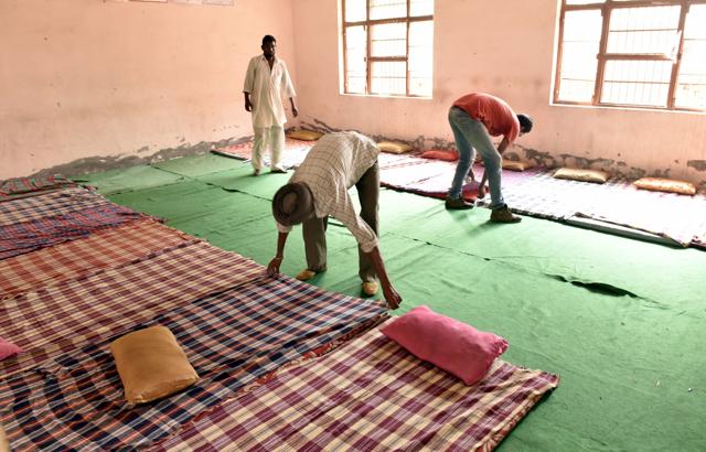Mattresses being set up for displaced people at the Khassa village school near Amritsar. (Gurpreet Singh/HT Photo) 